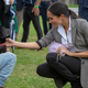 Meghan, Duchess of Sussex pats a dog at a Community Event at Victoria Park on Oct. 17, 2018 in Dubbo, Australia.